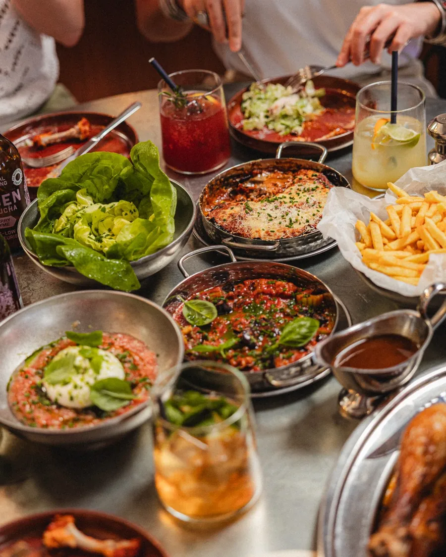 A table full of Stella dishes and drinks